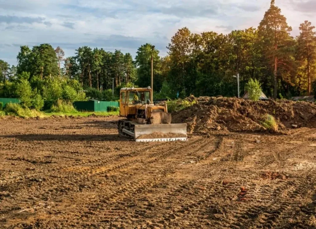 Bulldozer clearing dirt lot