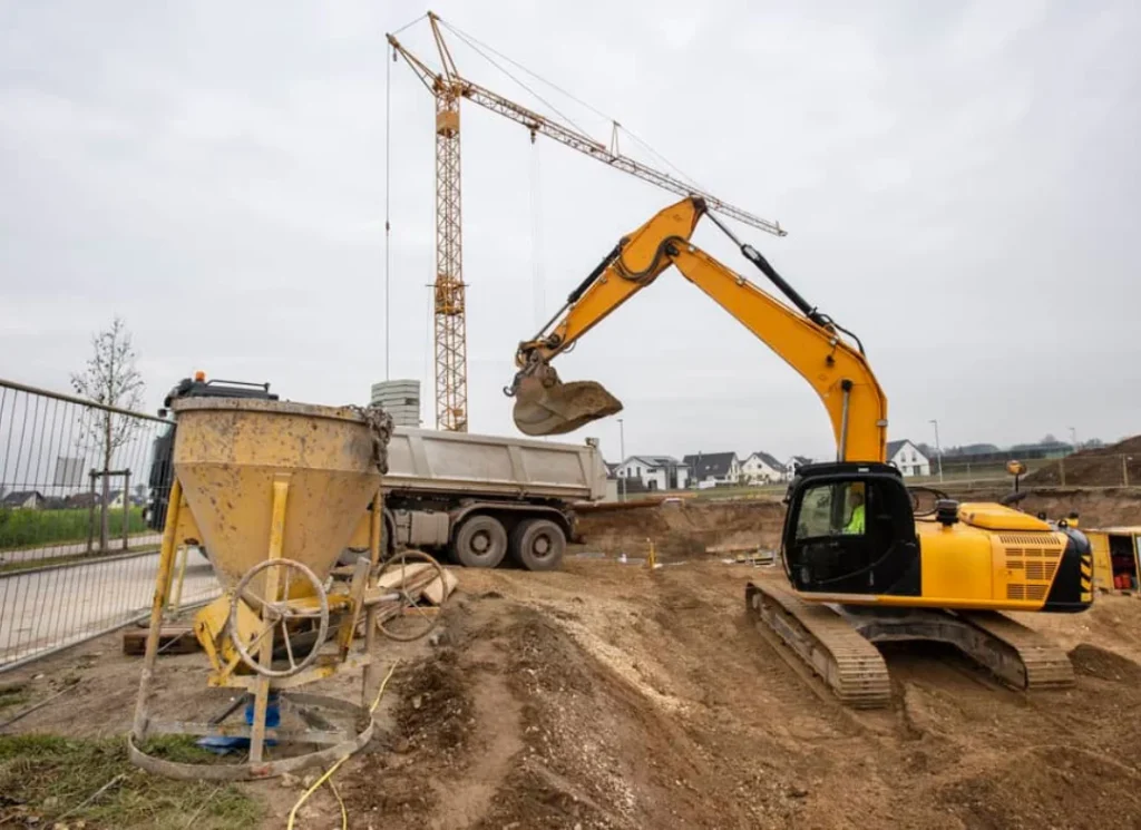 Excavator loading dump truck